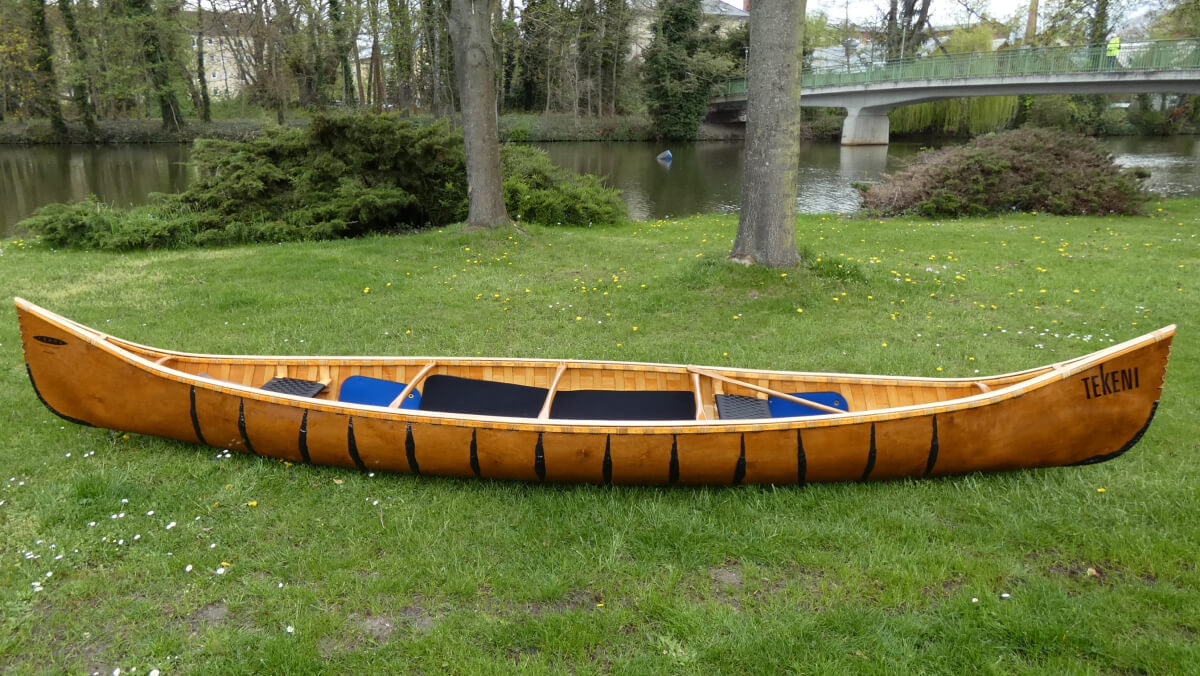 Frame Wagner Canoe Malecite 16Foot on a meadow side view